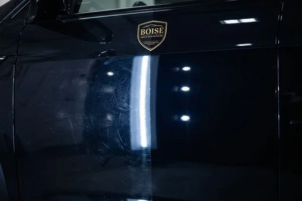 Paint correction before and after on dark paint