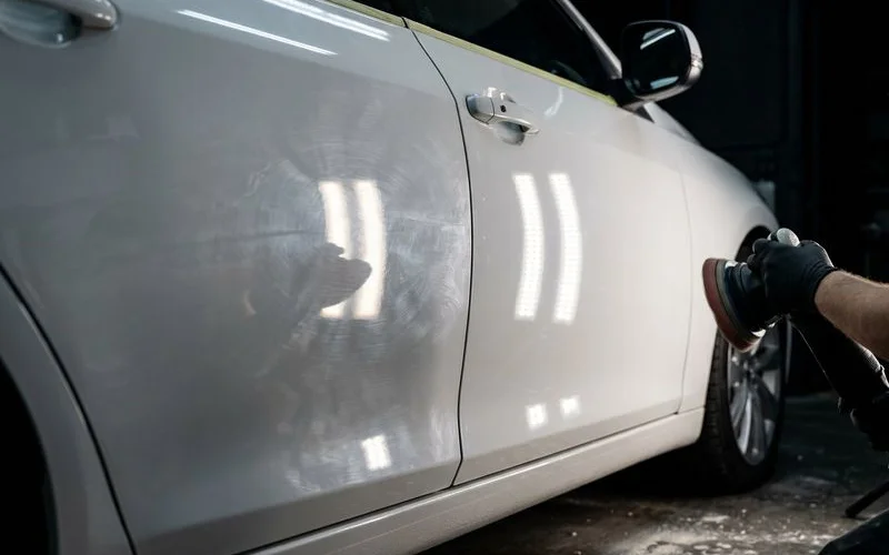 Before and after single stage paint correction showing significant improvement in paint clarity on sedan