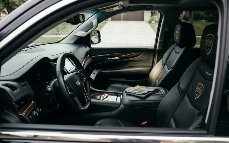 Pristine vehicle interior after professional detailing with clean surfaces conditioned leather and fresh appearance